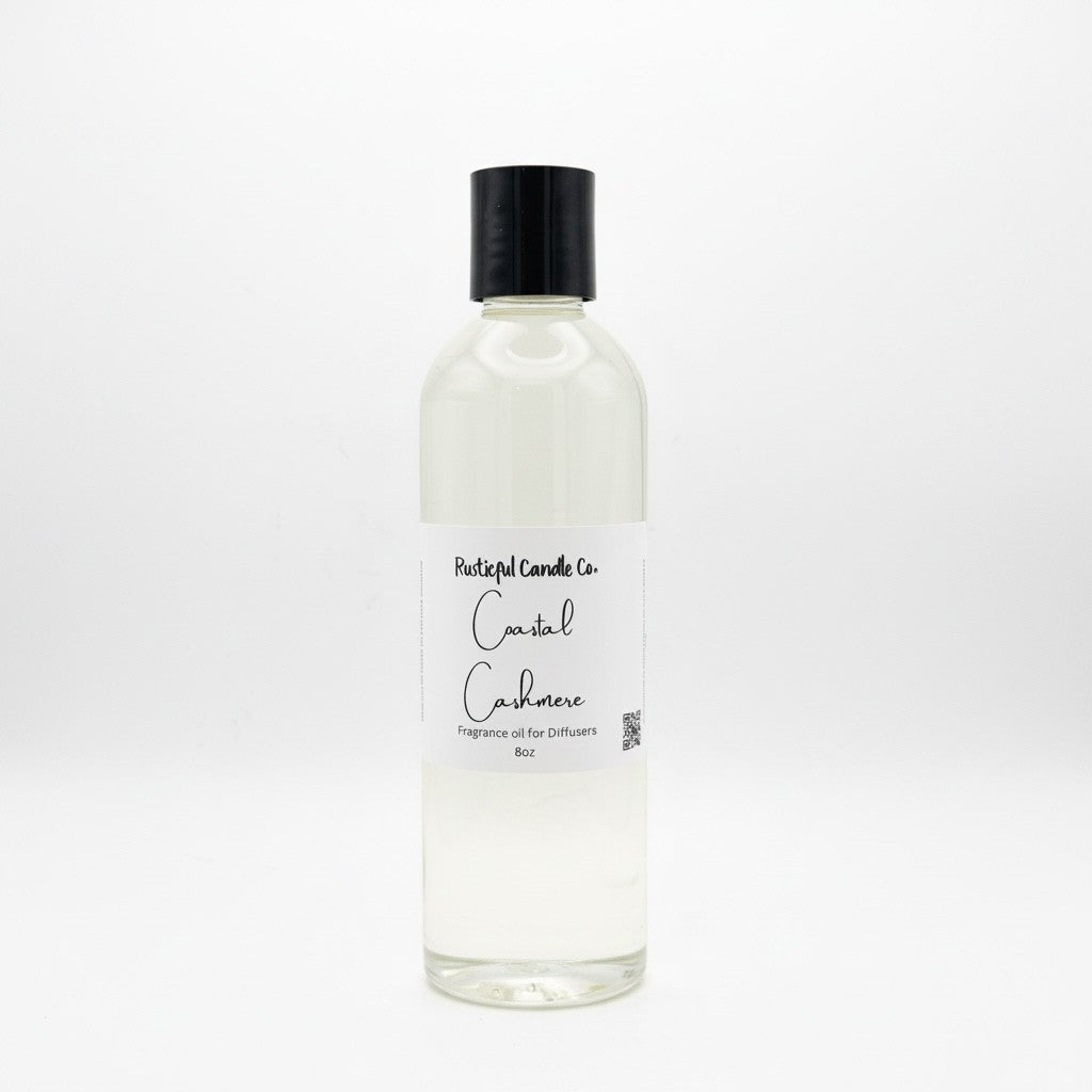 A clear glass bottle of Fragrant Candle Co. Coastal Cadaver fragrance oil with a black cap and white label, set against a seamless white background.