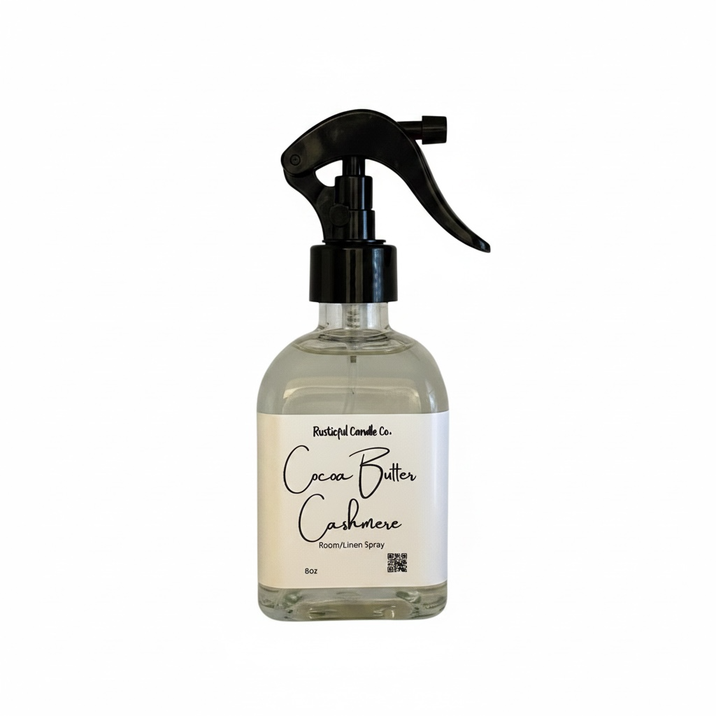 Clear spray bottle with black nozzle labeled 'Cocoa Butter Cashmere' on a white background