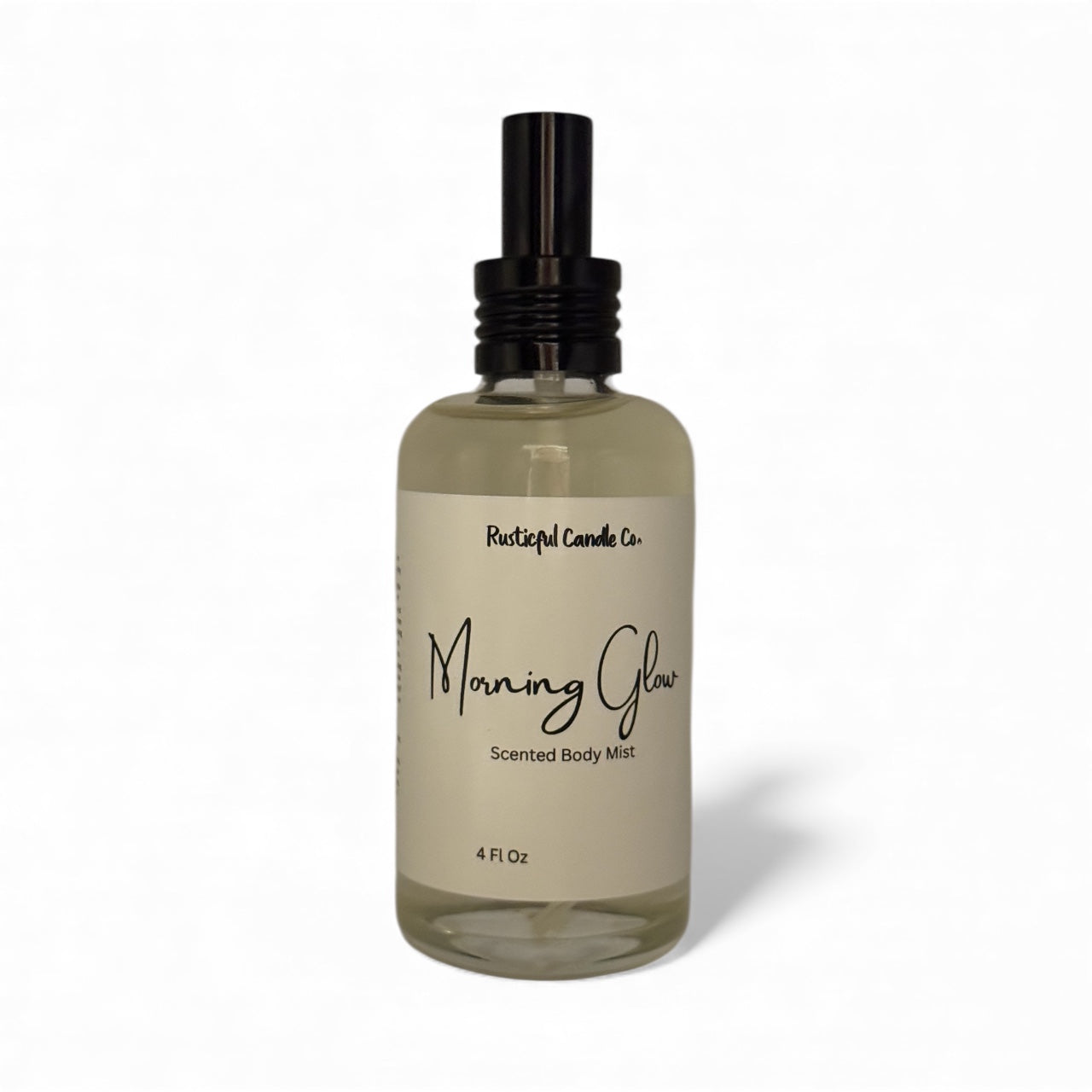 Clear bottle of 'Morning Glow' scented body mist with a black spray nozzle on a white background.