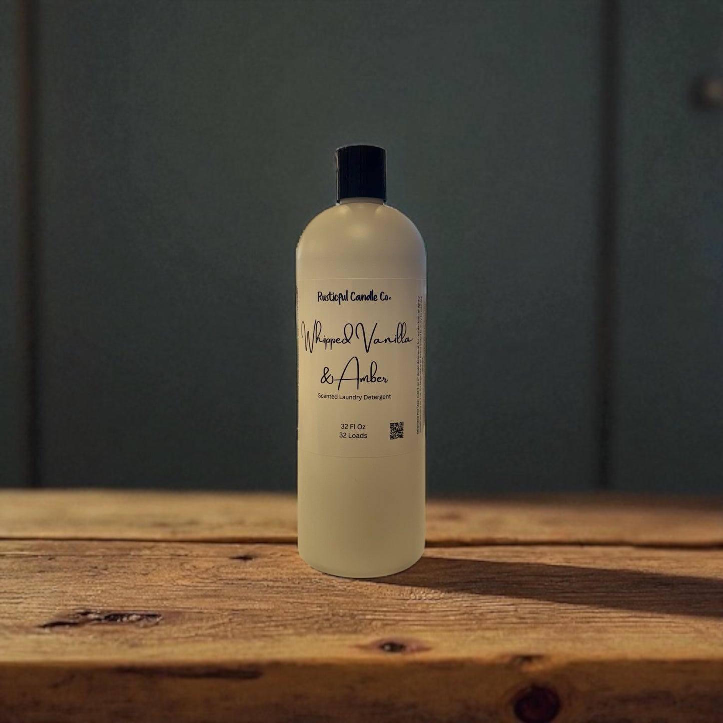 "Whipped Vanilla & Amber Liquid Laundry Soap by Rusticful Candle Co — scented with velvet plum, vanilla orchid, whipped amber, and sandalwood"