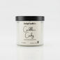 Candle jar labeled 'Cadillac Cowboy' by Rusticful Candle Co. on a white background
