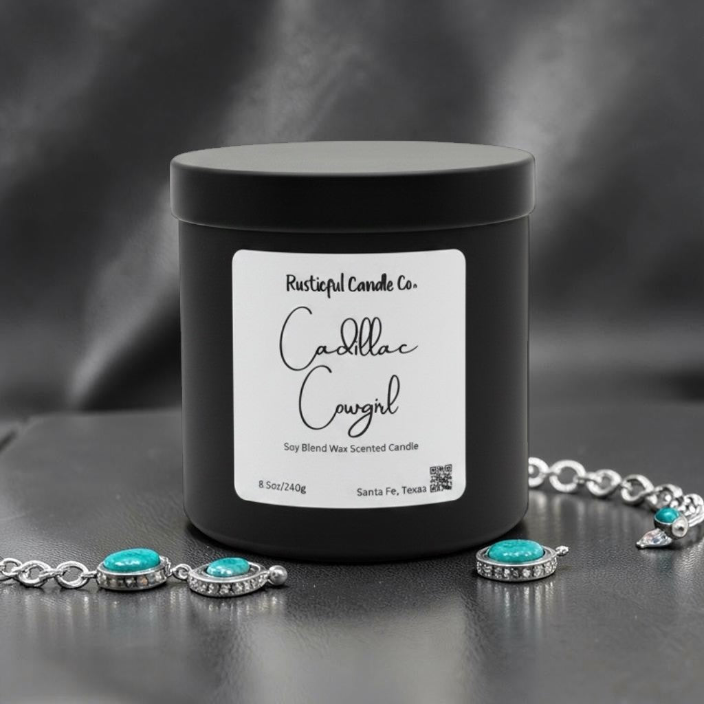 Black candle jar with 'Rusticful Candle Co.' label and jewelry on a dark background