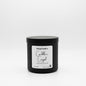 Black candle jar with a label on a white background