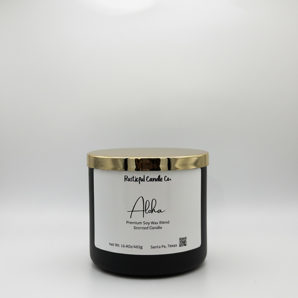 Black candle with gold lid and white label on a light gray background