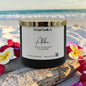 Candle with 'Rusticful Candle Co.' label on a beach setting