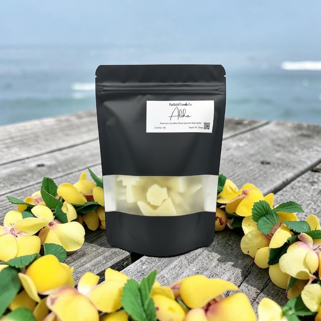 Black packaging with a label on a wooden surface with yellow flowers and water in the background