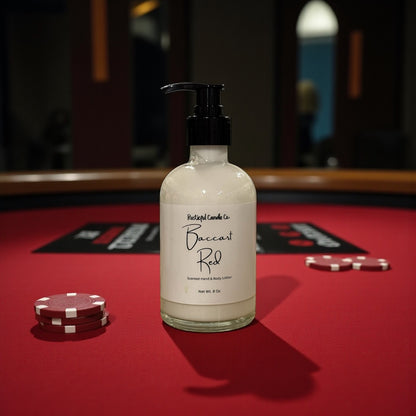 Bottle of Baccarat Red candle on a red felt surface with poker chips.