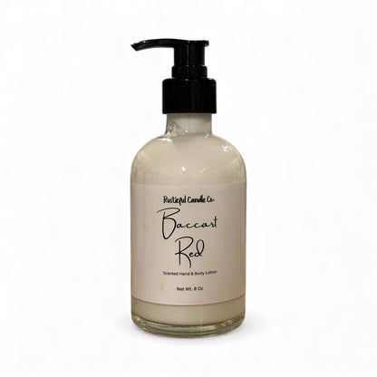 Bottle of Baccarat Red scented hand and body lotion with a pump on a white background