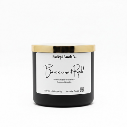 Black candle with gold lid and white label on a white background