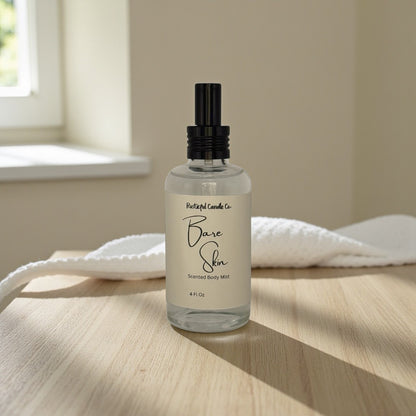 Bottle of 'Bare Skin' body mist on a wooden surface with a neutral background