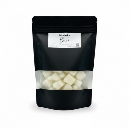 Black packaging of a candle company with visible product inside on a white background
