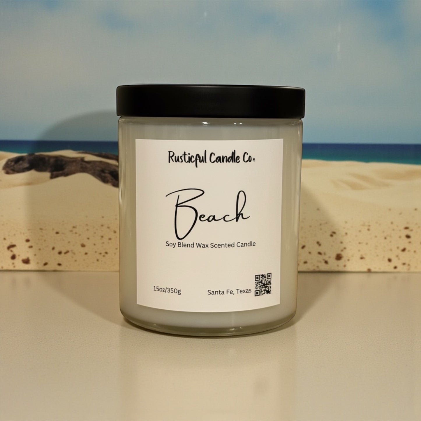 Candle labeled 'Beach' from Rusticful Candle Co. with a beach scene in the background