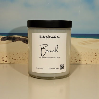 Candle labeled 'Beach' from Rusticful Candle Co. with a beach scene in the background