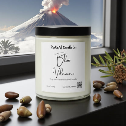 Candle labeled 'Blue Volcano' from Rusticful Candle Co. with a volcano and palm trees in the background.