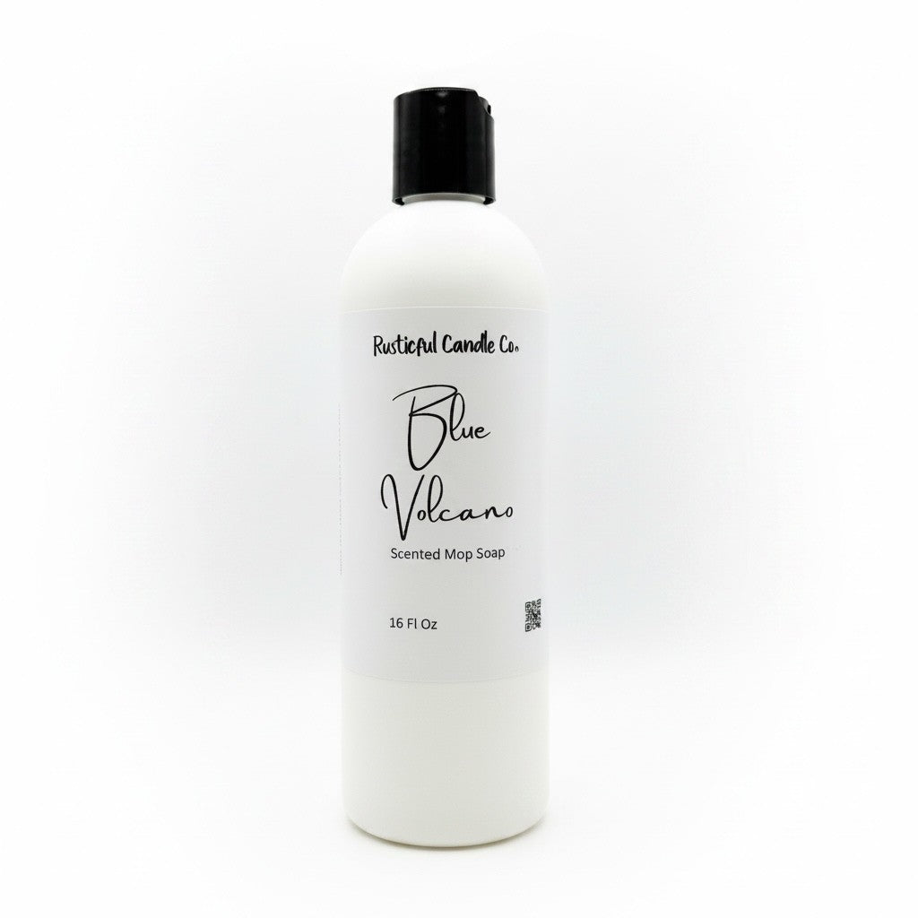 A 16 fl oz white bottle of Rustical Candle Co. Blue Volcano Scented Mop Soap with a black cap, shown on a clean white background.