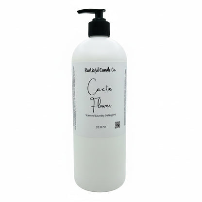 A 32 fl oz white plastic bottle of Rustleup Candle Co. Cactus Flower Scented Laundry Detergent with a black pump dispenser and a white label, shown on a plain white background.