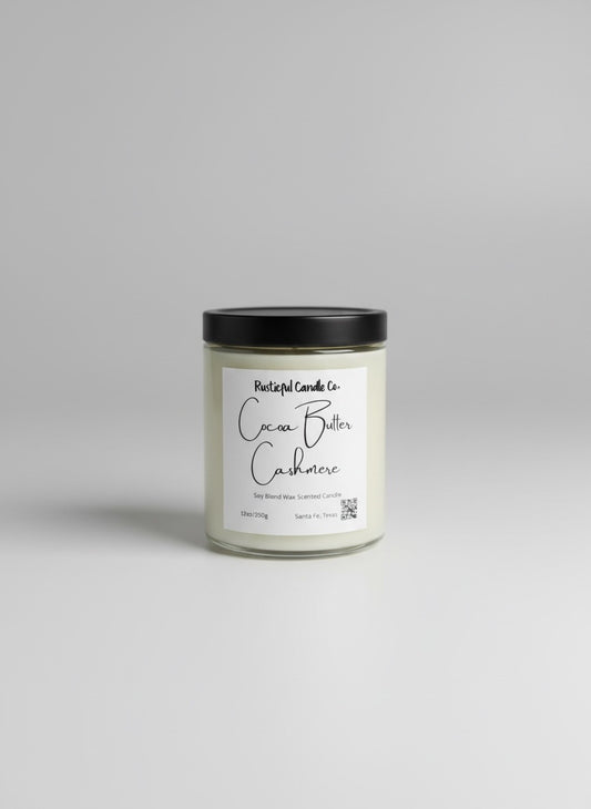 Candle jar with a black lid and white label on a gray background