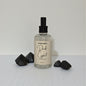 Body mist bottle labeled 'Dark Crystal' with black geometric shapes on a light gray background
