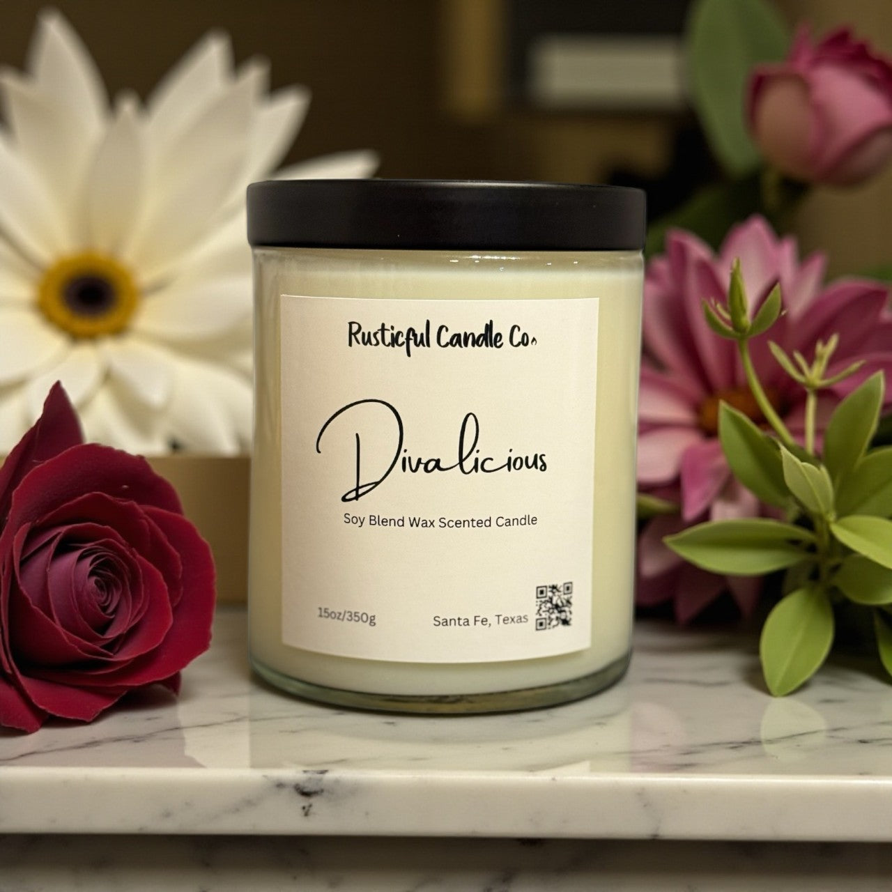 Luxury 2-wick floral candle on vanity with soft lighting, Divalicious scent by Rusticful Candle Co