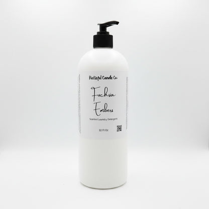 A 32 fl oz white plastic bottle of Rustical Candles Co. 'Fuchsia Emboss' laundry detergent with a black pump dispenser and a white label, set against a seamless white background.