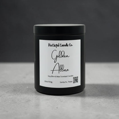 A black plastic jar candle with a white label reading 'Rustical Candle Co. Golden Allure' on a gray surface against a dark gray background.