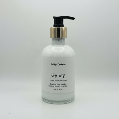 Bottle of 'Gypsy' scented hand and body lotion with a pump on a white background