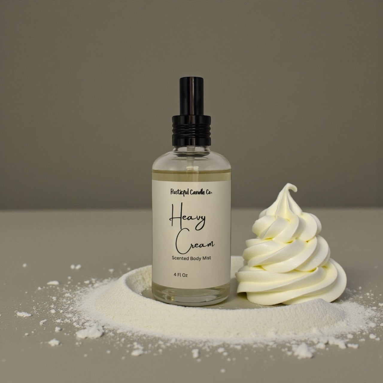 Bottle of 'Heavy Cream' scented body milk with a dollop of whipped cream on a neutral background