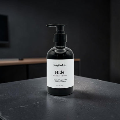 Black bottle of 'Hide' lotion on a dark surface with a black background