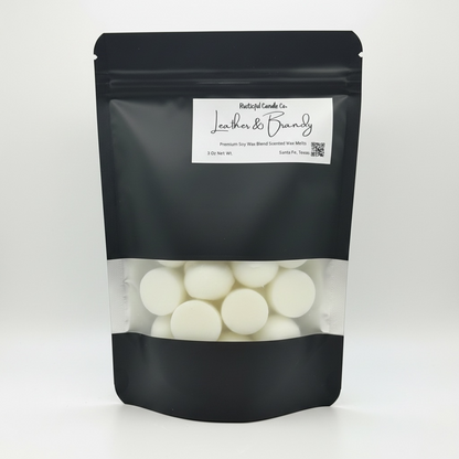 Black packaging of wax melts with a visible brand label on a white background