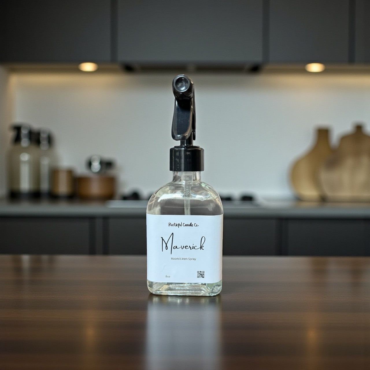 Clear spray bottle labeled 'Maverick' on a kitchen counter