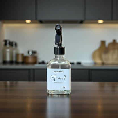 Clear spray bottle labeled 'Maverick' on a kitchen counter