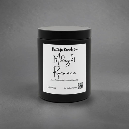 A black jar candle with a white label reading 'Rustical Candle Co. Midnight Romance' on a textured gray background.