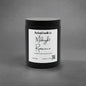 A black jar candle with a white label reading 'Rustical Candle Co. Midnight Romance' on a textured gray background.