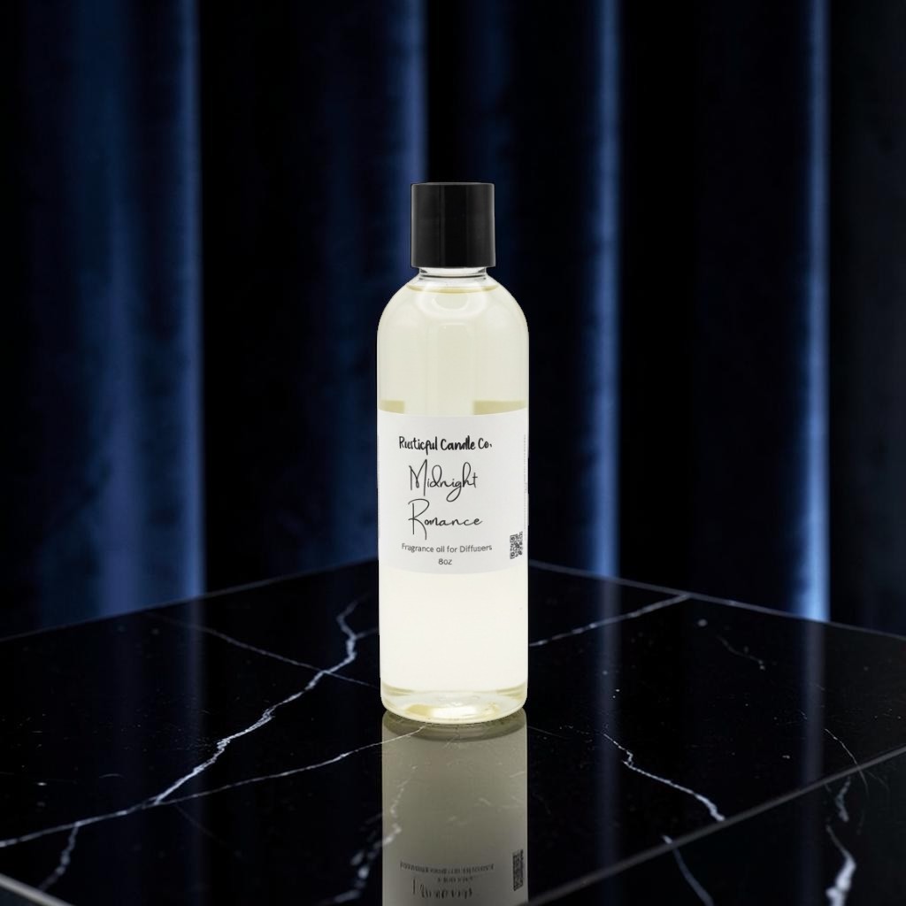 A clear bottle of Mayi Rose essential oil by Portugal Candle Co. with a black cap, standing on a black marble surface against a dark blue curtain background.