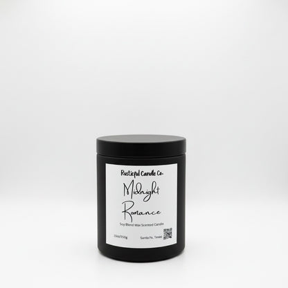 A black jar candle with a white label reading 'Rustical Candle Co. Midnight Romance' on a clean white background.