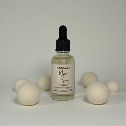 Bottle of Mystic Man product with wooden balls on a neutral background