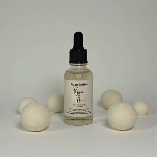 Bottle of Mystic Man product with wooden balls on a neutral background