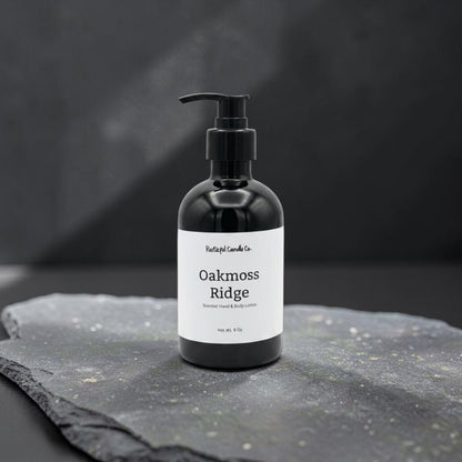 Black bottle labeled 'Oakmoss Ridge' on a dark stone surface with a black background