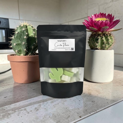 Black package labeled 'Cactus Flowers' with cacti in the background