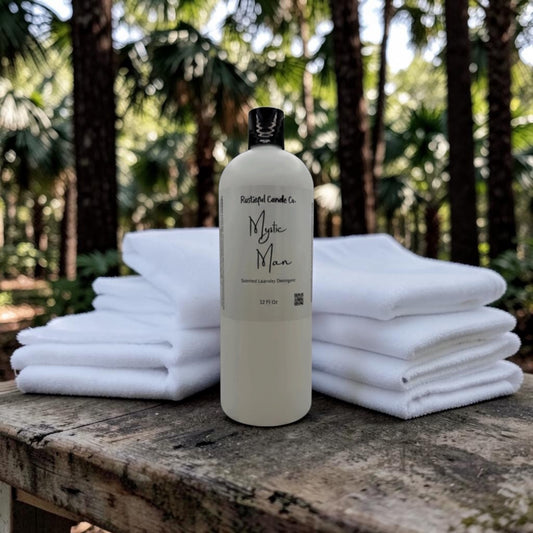 Bottle of 'Mythic Man' product with folded towels on a wooden surface outdoors.