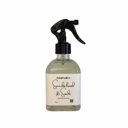 Bottle of Sandalwood & Suede room spray on a white background