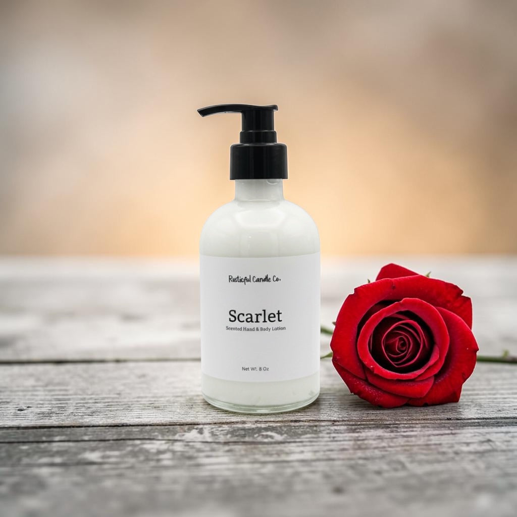 White bottle labeled 'Scarlet' with a red rose on a wooden surface