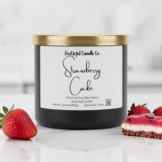 Candle labeled 'Strawberry Cake' from Rusticful Candle Co. with strawberries and cake on a white background