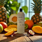 Bottle of 'Tropical Fruit Infusion' shampoo on a wooden surface with fruits in the background
