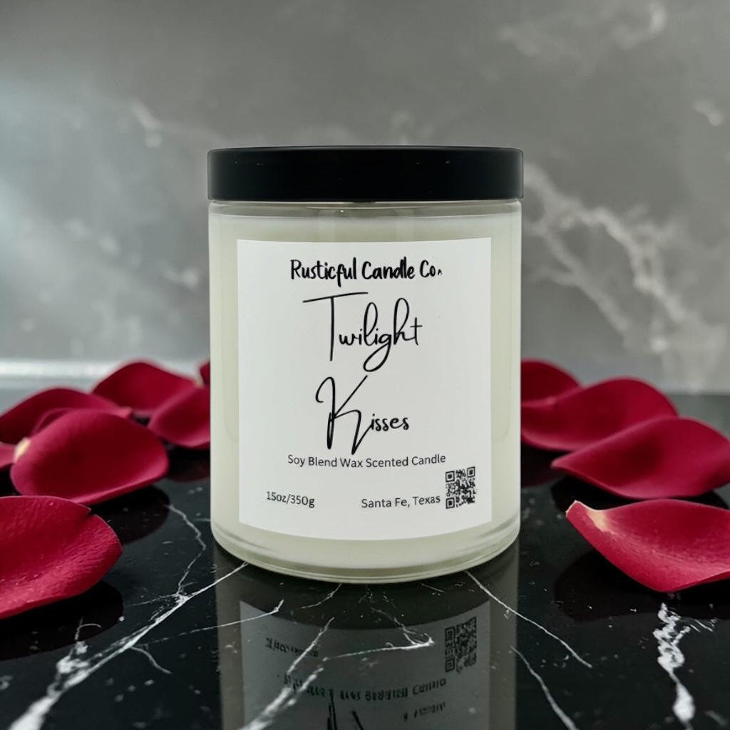 Candle with a label on a reflective surface with red petals