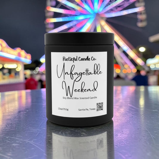 Black candle labeled 'Unforgettable Weekend' with a colorful Ferris wheel in the background