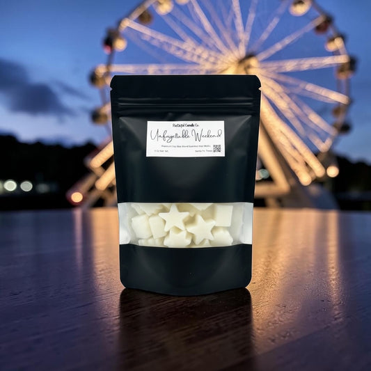Black package with white stars on a wooden surface with a Ferris wheel in the background