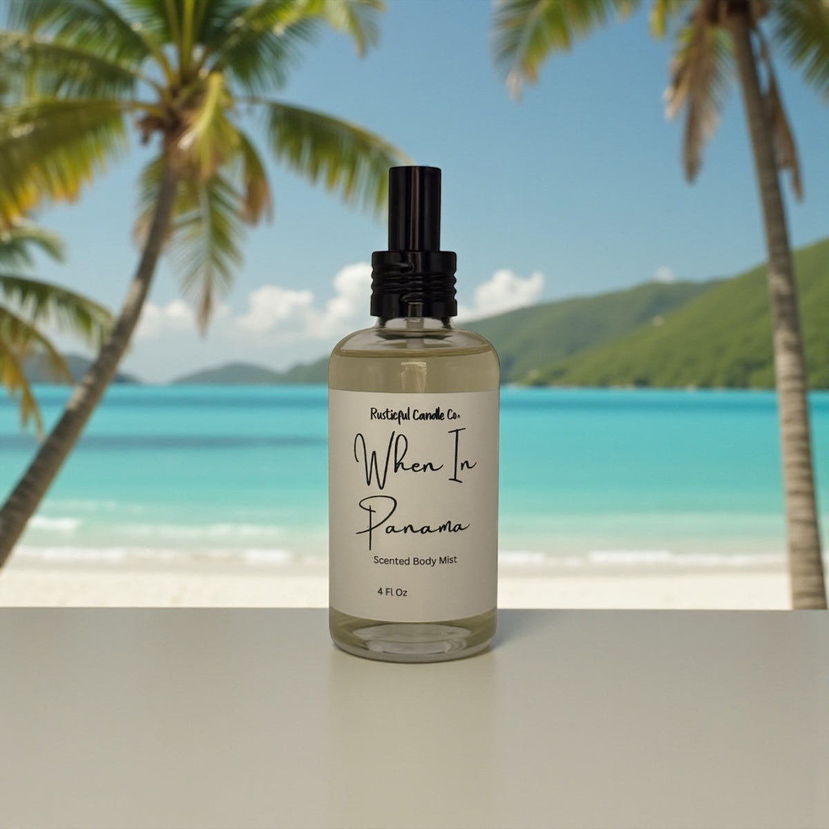 Bottle of 'When In Panama' scented body mist with a tropical beach background