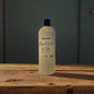 "Whipped Vanilla & Amber Liquid Laundry Soap by Rusticful Candle Co — scented with velvet plum, vanilla orchid, whipped amber, and sandalwood"