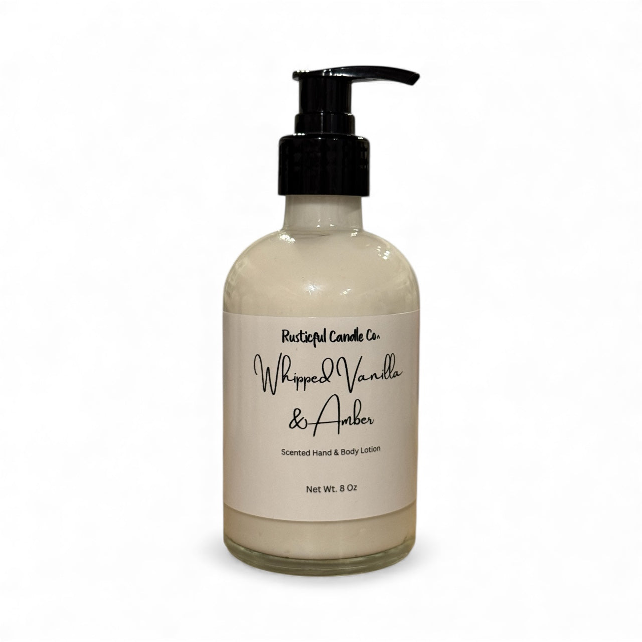 Hand and body lotion bottle labeled 'Whipped Vanilla & Amber' on a white background
